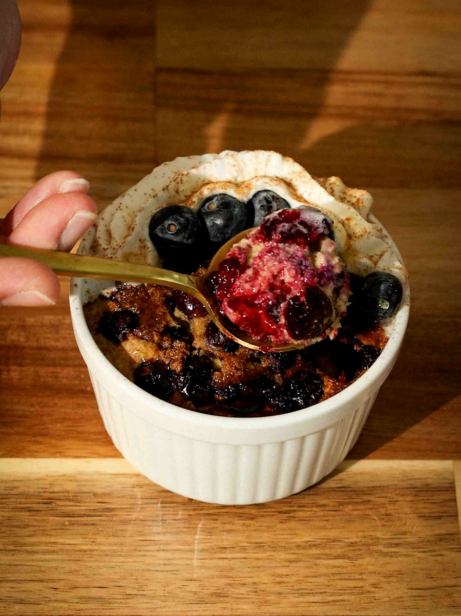 A ramekin of delicious Blueberry Cinnamon Baked Oats baked using the Magnifique Glass Air Fryer.