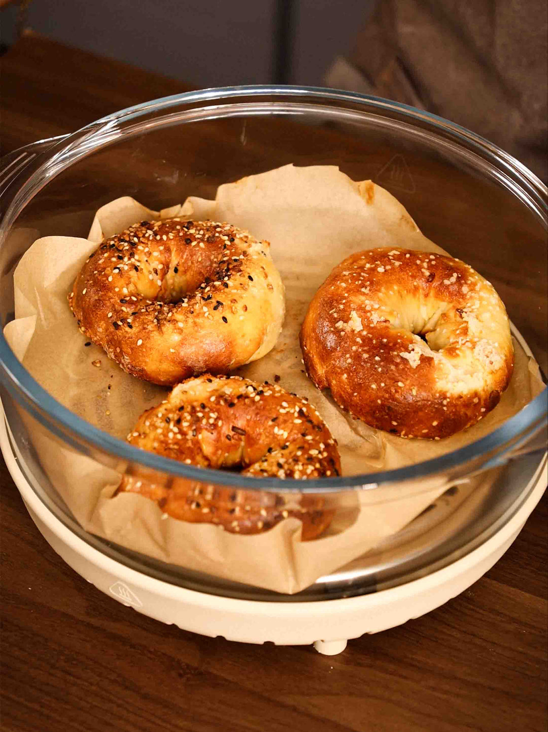 A batch of freshly baked Protein Bagels sitting in the Air Crisper Glass Pot Container. 