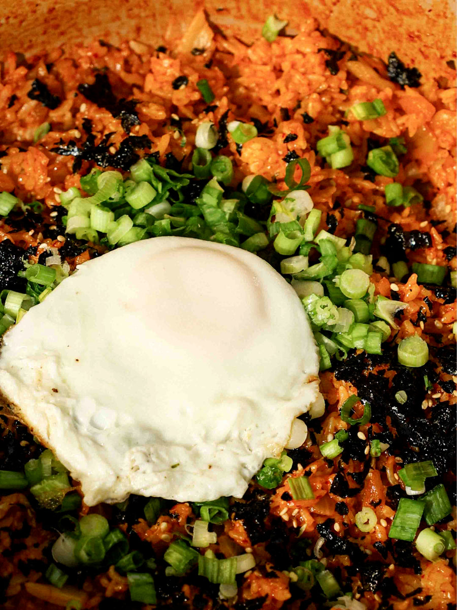 Spicy Kimchi Fried Rice in a Flami Pot with a fried egg on top. 