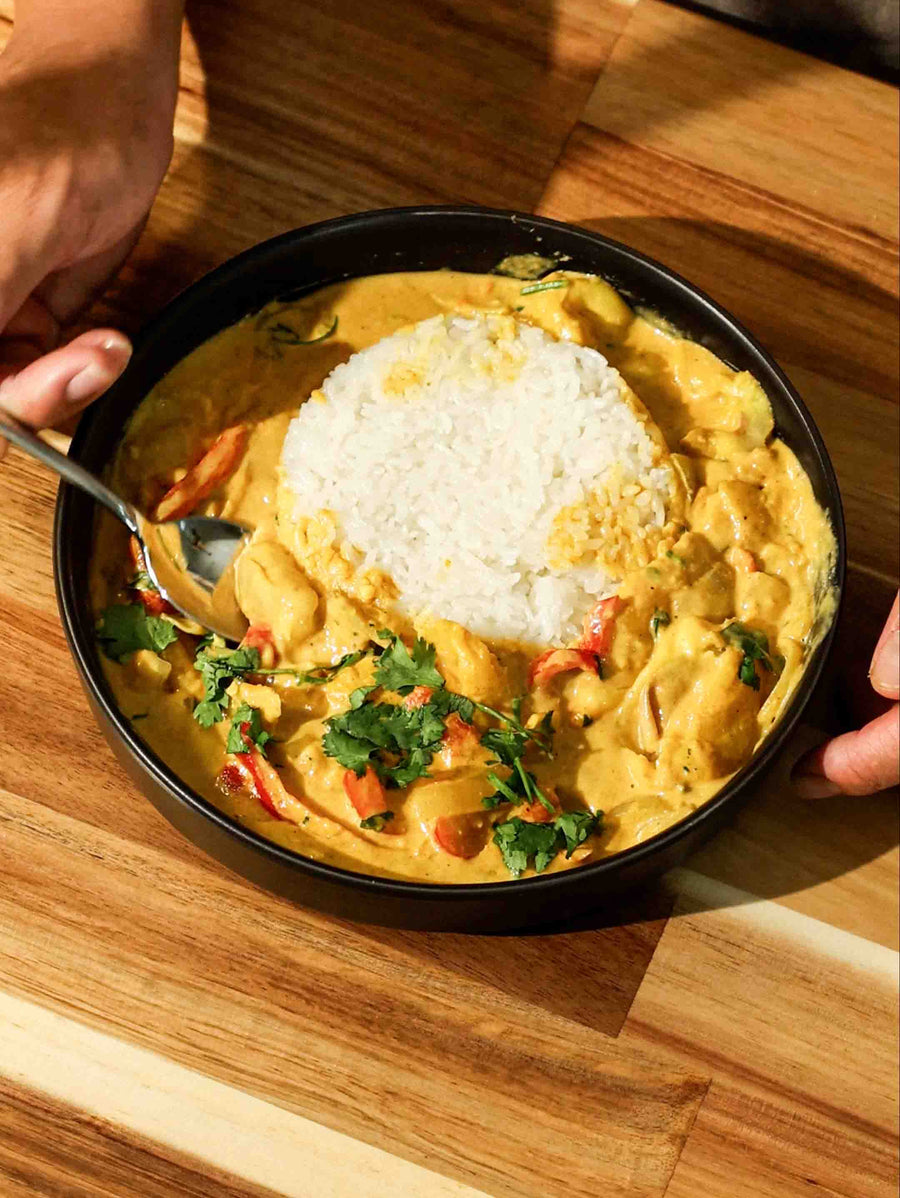 a bowl of delicious Thai Jackfruit Curry made using the Magnifique Clay Dutch Oven.