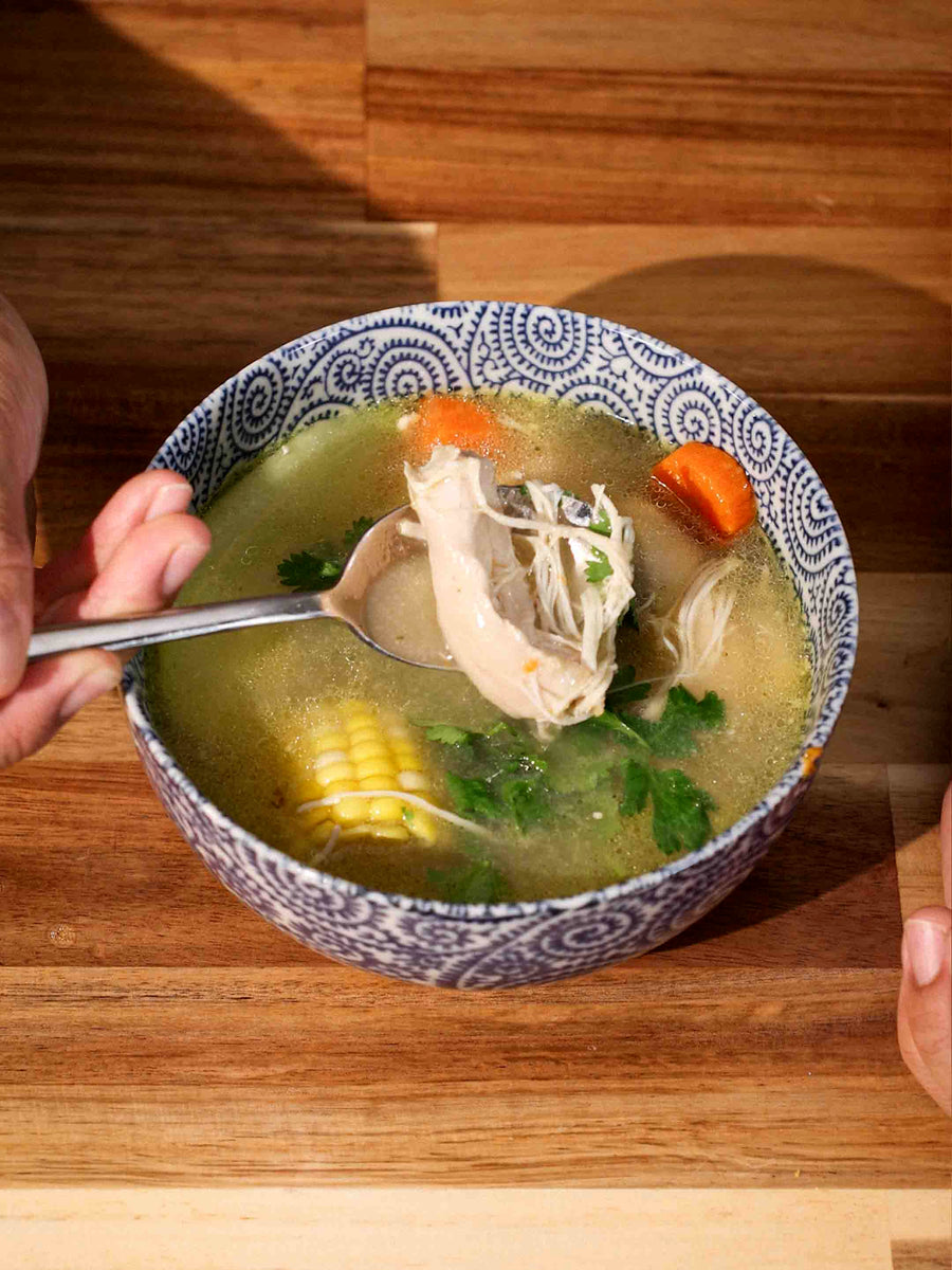 A rich bowl of Caldo de Pollo, made in the Magnifique Round Claypot Multi-Cooker.