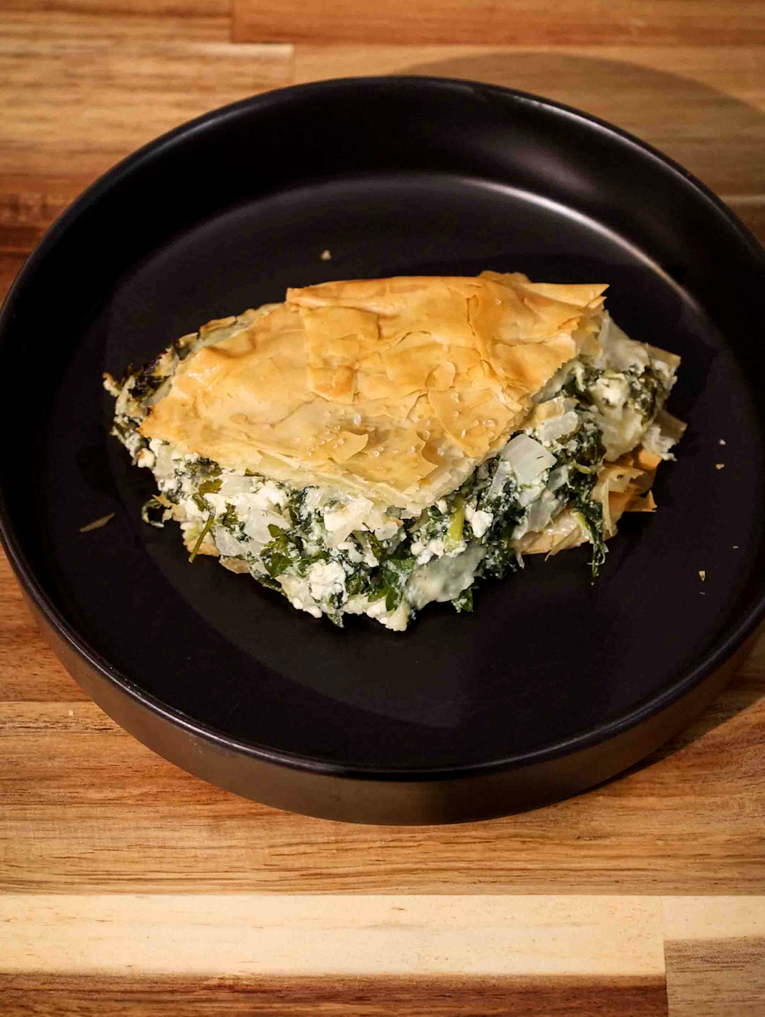 Plate of delicious Spanakopita , baked in a Magnifique Claypot Casserole. 