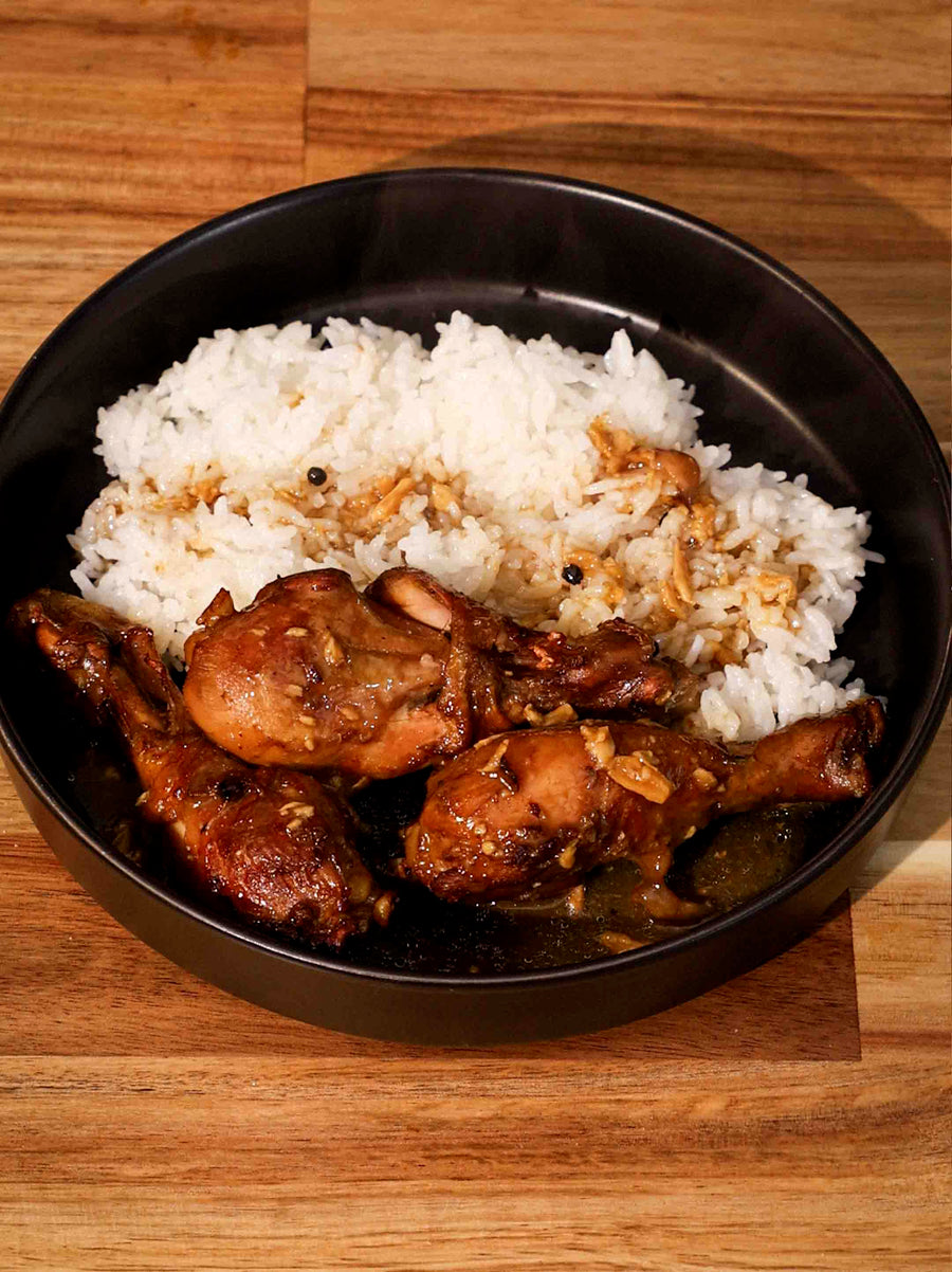 A dish with rice and delicious, crispy skin, garliky Chicken Adobo made with Magnifique Combo Air Fryer. 
