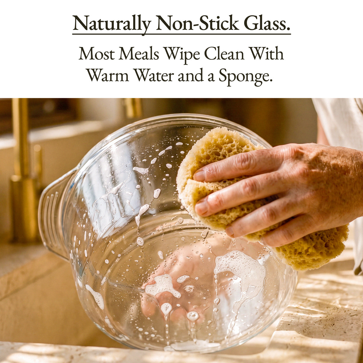 Image of a hand cleaning a naturally non-stick glass bowl, highlighting easy maintenance for The Combo Air Fryer.