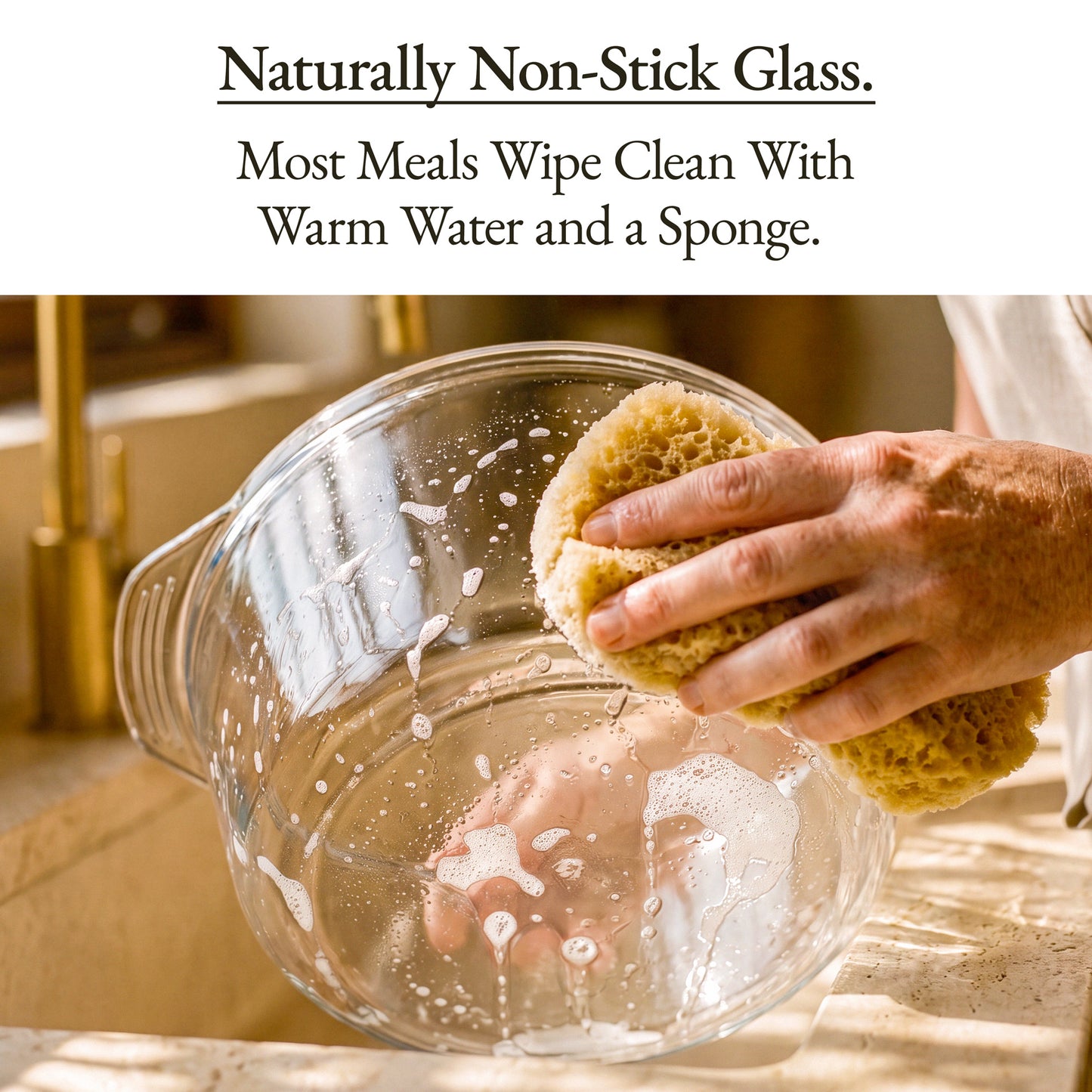 Image of a hand cleaning a naturally non-stick glass bowl, highlighting easy maintenance for The Combo Air Fryer.