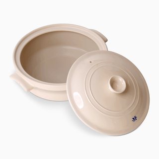 The Flami Pot: Handcrafted clay cookware with a lid, perfect for baking and cooking non-toxic meals.