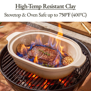 Casserole Claypot Multi-Cooker cooking steak with flames on grill, made from high-temp resistant clay.