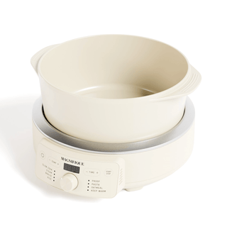 Round Claypot Multi-Cooker on a countertop, made of 100% pure clay for healthy cooking.