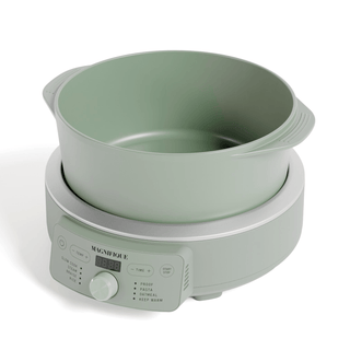 Round Claypot Multi-Cooker in soft green with digital controls for non-toxic cooking.