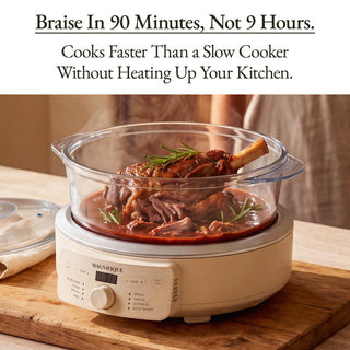 Magnifique slow cooker with a glass roasting pan containing a cooked meat dish, shown on a wooden surface with a lid beside it. Text at the top reads, 'Braise In 90 Minutes, Not 9 Hours.