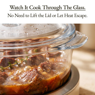 A clear glass cooking pot with a lid, shown with text at the top reading 'Watch It Cook Through The Glass. No Need to Lift the Lid or Let Heat Escape.