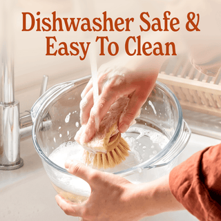Hand scrubbing a Glass Pot Multi-Cooker in the sink, highlighting its easy cleaning and dishwasher safe features.