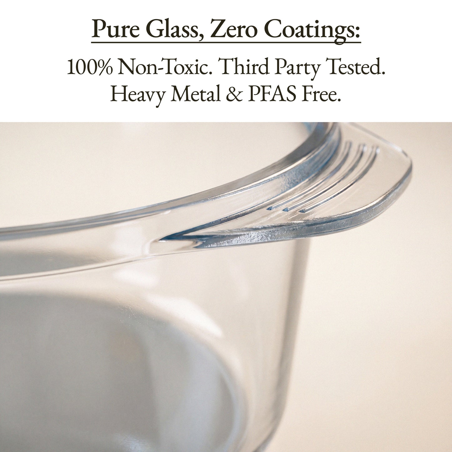Close-up of a clear glass measuring cup with a pouring spout, with text at the top reading 'Pure Glass, Zero Coatings: 100% Non-Toxic. Third Party Tested.
